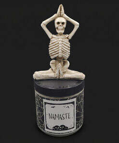 Arms above head namaste candle